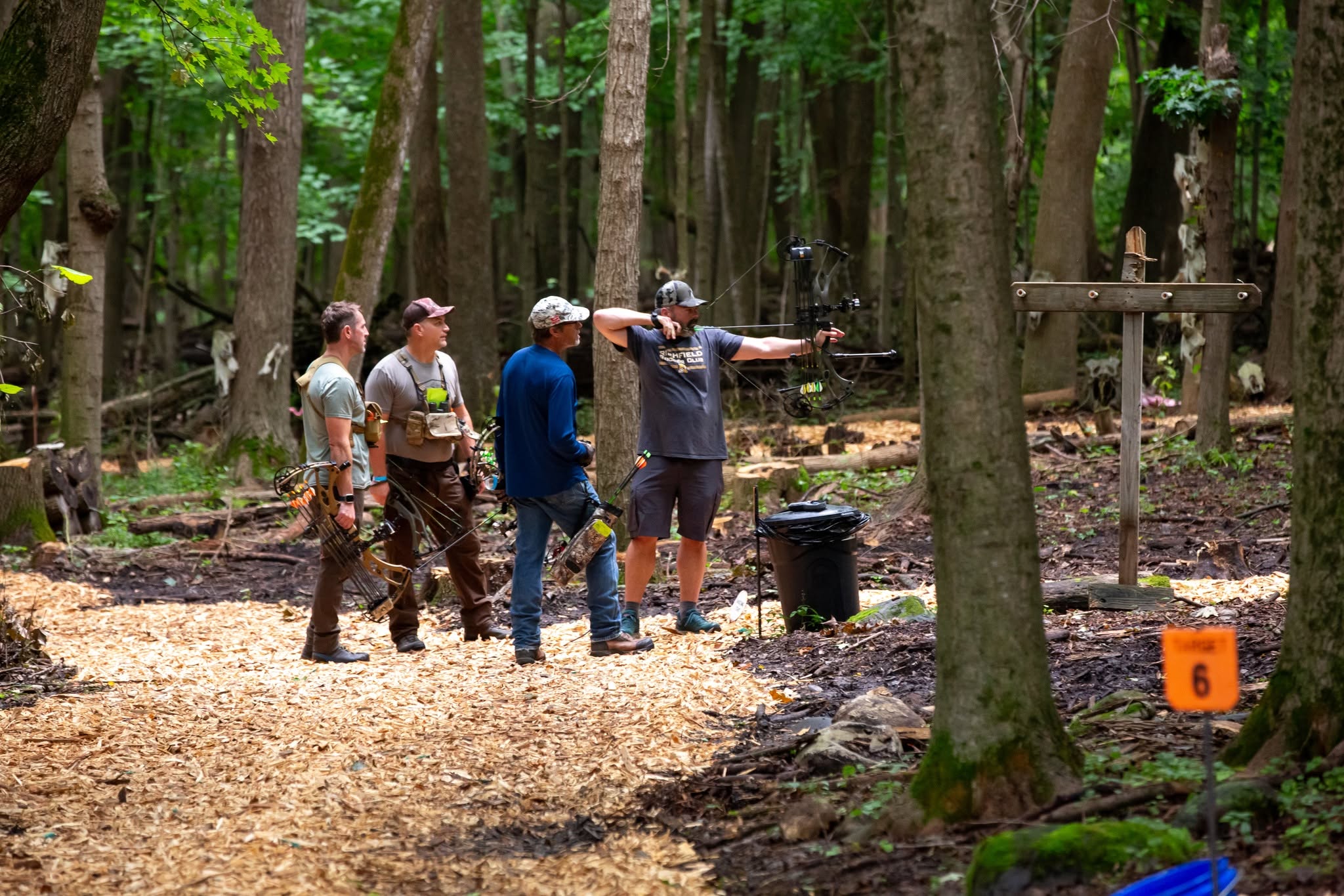 Archer releasing an arrow during guided practice